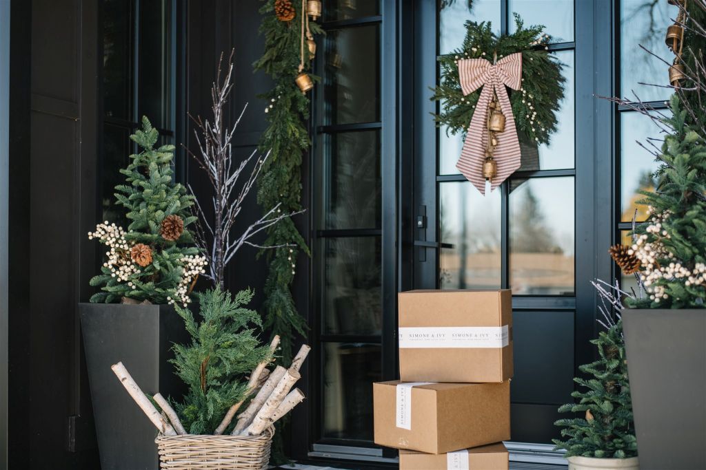 wreaths, greenery and holiday packages at a front door in St. Albert, AB