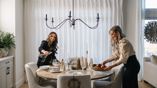 two hostesses get ready for an event in their home in Edmonton, AB