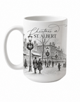 Christmas in St. Albert mug with a black-and-white festive town scene on a white background.